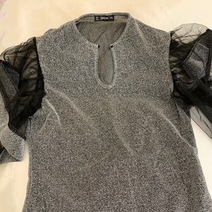 Shimmery gray and black top.